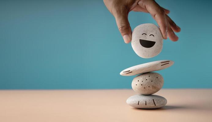 enjoying life concept harmony and positive mind hand setting white natural stone stack to balance balancing body mind soul and spirit mental health practice photo 1